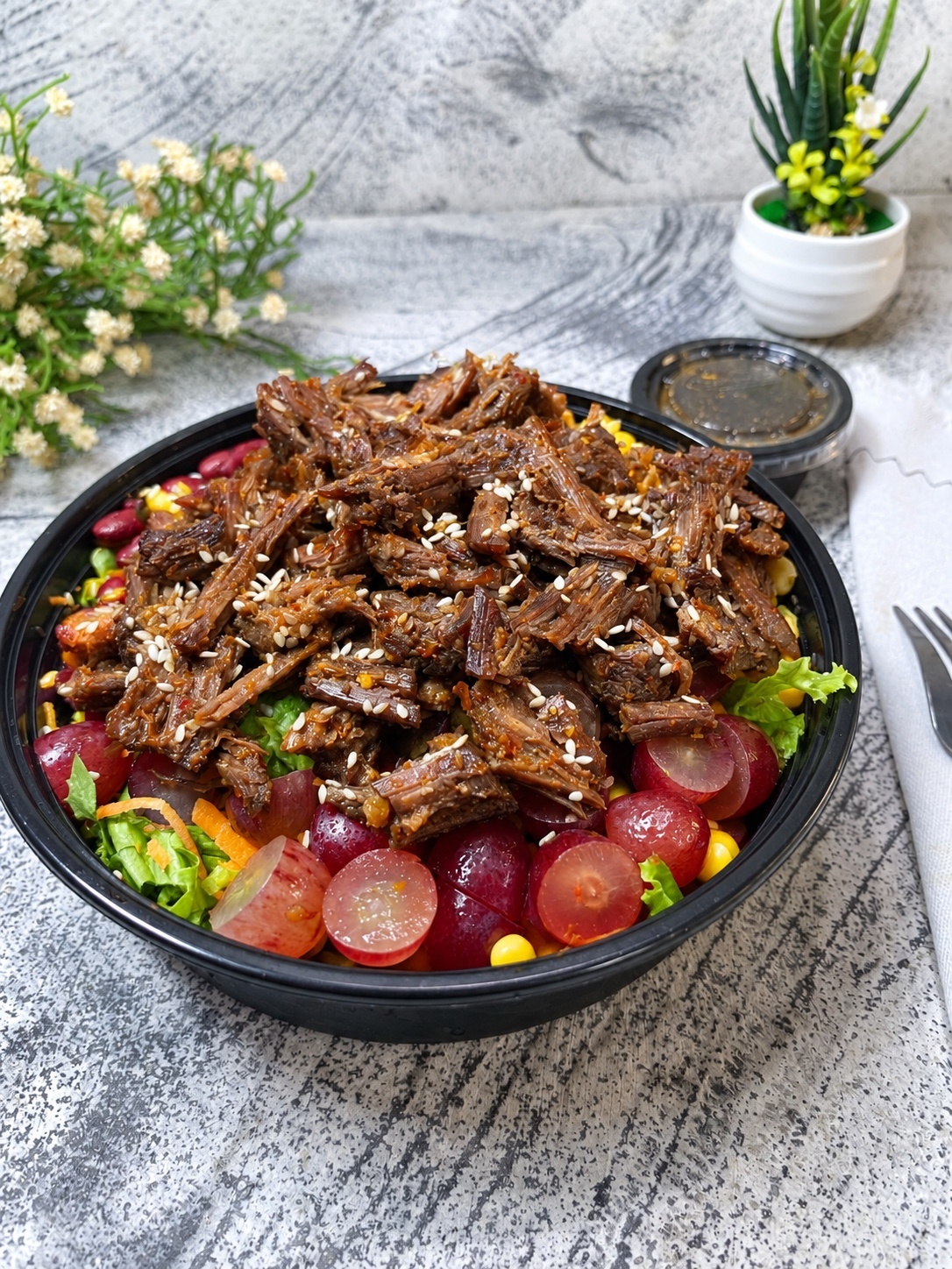Sweet & spicy pulled beef salad with citris vinaigrette