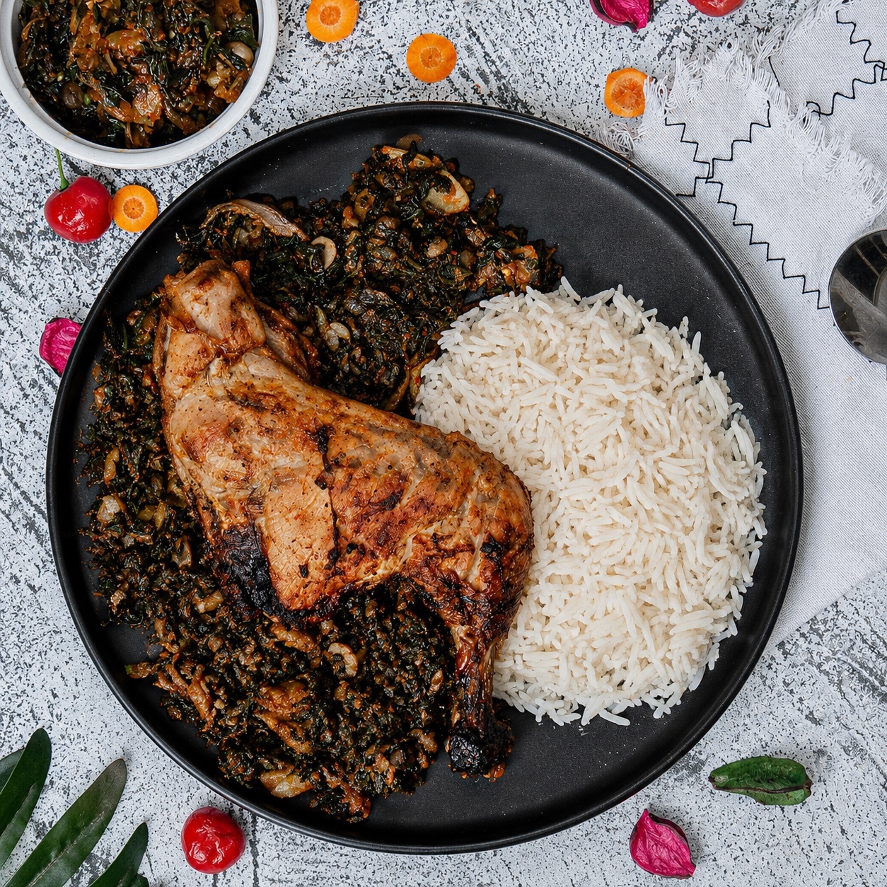 Basmati rice / oil-less efo riro / grilled chicken thighs
