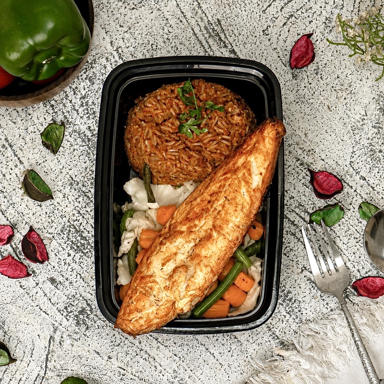Jollof Brown Rice with Grilled Titus Fish Fillet & Stir fry Vegetables